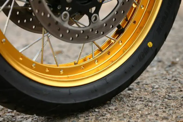 Motorcycle sealed spoked wheel